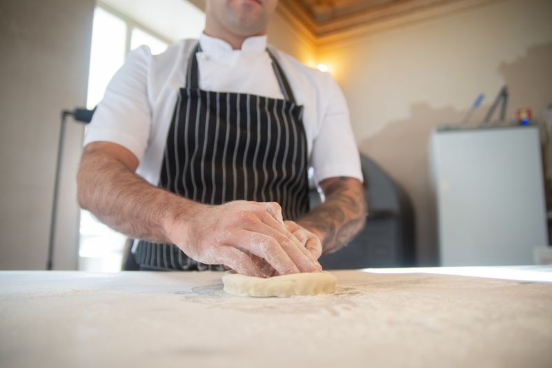 Dewey's pizza kitchen crafting handmade pizza dough
